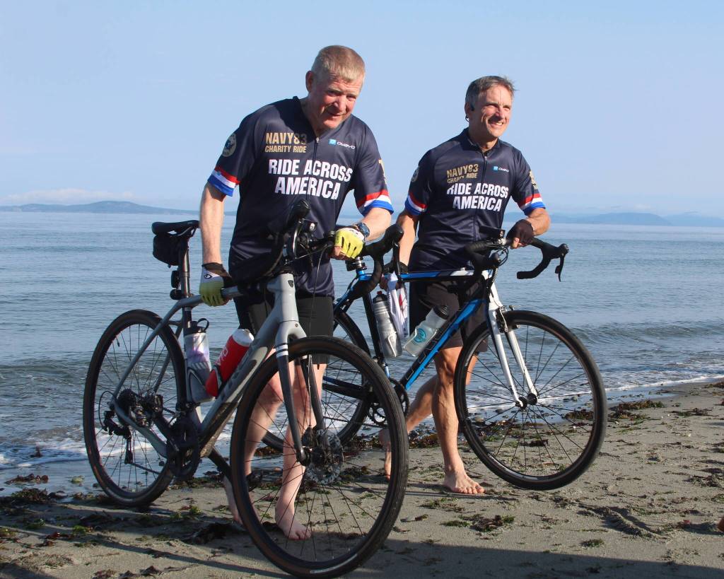 Photo by Karina Andrew/Whidbey News-Times
Cyclists dip their tires in the Salish Sea.