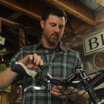 Photo by Karina Andrew/Whidbey News-Times
Trevor Stevens, owner of Celerity Cycles, fixes a bicycle in his home shop in Coupeville.