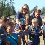 Photo by Karina Andrew/Whidbey News-Times
Hillcrest Elementary School President Samantha Horrobin cuts the ribbon at the opening of the newly paved walking path Sept. 15.