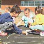 Photo by Karina Andrew/Whidbey News-Times
First grader Ian Kerner helps chalk the walk Sept. 15 at Hillcrest Elementary School.