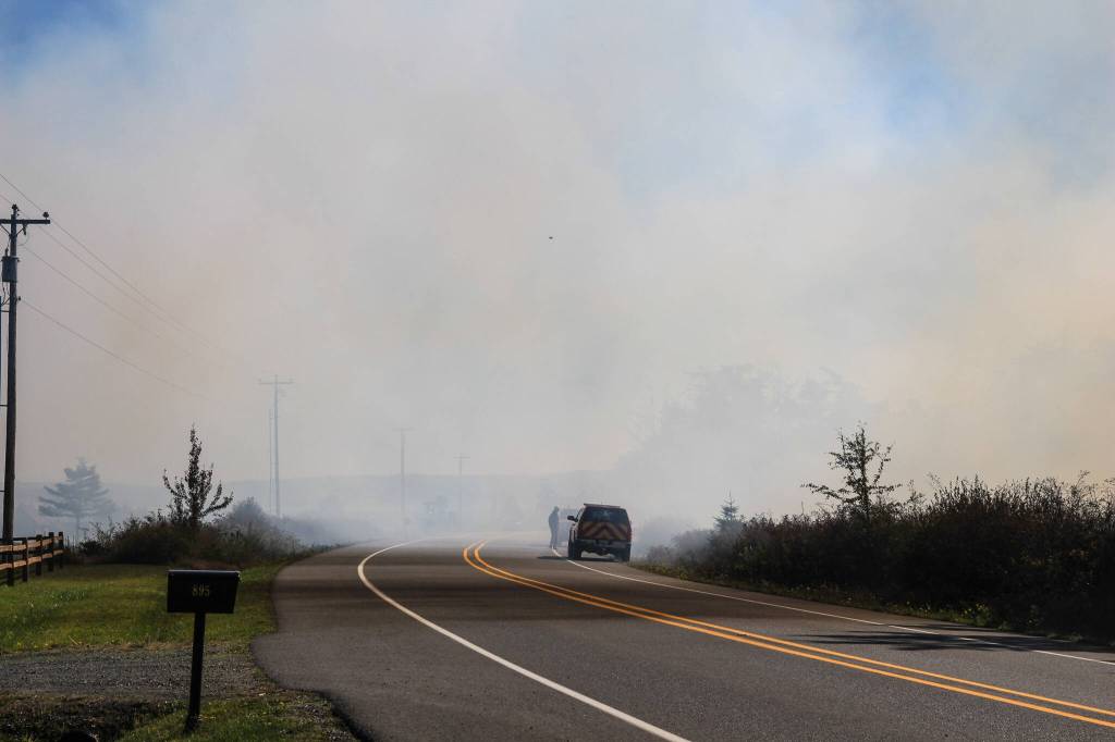 The smoke from the fires covered the clear sky, as seen from Engle Road. (Photo by Luisa Loi/Whidbey News-Times)