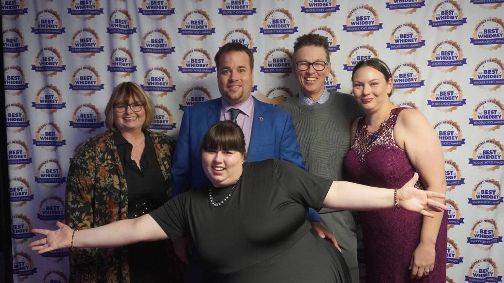The Hoffmire family poses for a photo. Shane Hoffmire, at center, won the coveted Best Community Leader of the Year category. (Photo by Adrian Magana)