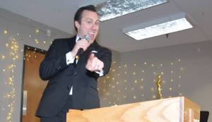 Photo by Megan Yerton
Master of Ceremonies Bryan Stucky points to some of his future customers. Stucky was also awarded as the Best Businessperson of the Year and his business, Wallin-Stucky Funeral Home, won Best Business of the Year.