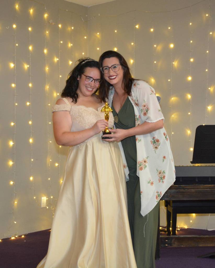 Whidbey News-Times Samanthajoy Fatlan presents a trophy to Marri Metz for Best Party Rental. (Photo by Megan Yerton)