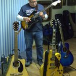 Gary Raster shows some of his guitars at his house. (Photo by Luisa Loi)