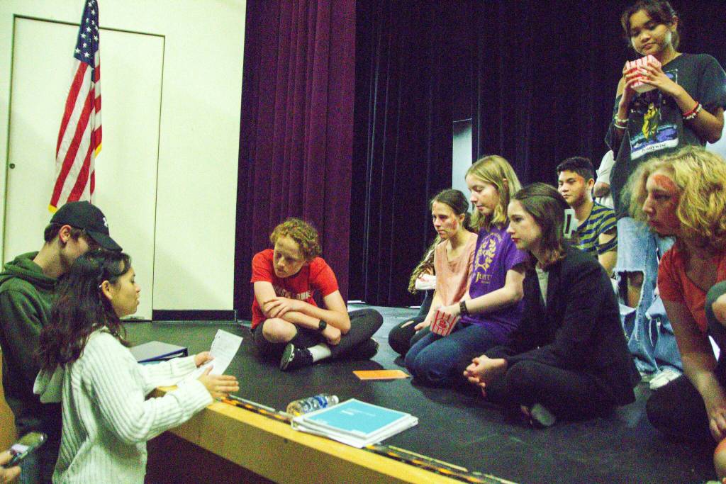 Dana Rivo and Ethan Johnson go over notes with the cast of 10 Ways to Survive a Zombie Apocalypse. (Photo by Luisa Loi)