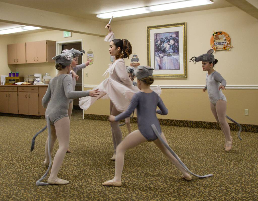 A group of mice, played by Michaela Reed, Piper Arrington, Clara Kettlewell, Olivia Hamilton and Evangeline Holton, surround a terrified Clara, played by Hannah Brackeen. (Photo by Luisa Loi)