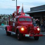 A large crowd cheered as Santa arrived at Dock & Pioneer on board of a shiny red truck. (Photo by Luisa Loi)