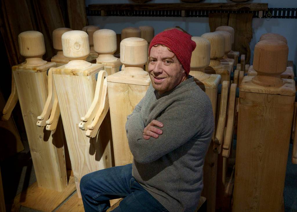 Kelly Cameron of Turnco Wood Goods created a bevy of giant wooden doll sculptures as part of a grant that was awarded to the Clinton Chamber of Commerce. (Photo by David Welton)