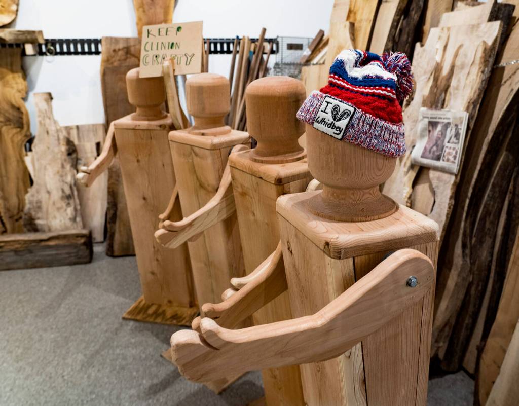 The giant wooden dolls are about four feet tall and can wear clothes, such as this hat. (Photo by David Welton)