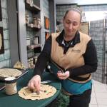 Kristi Uhles from TerraVen demonstrates how to play Seega, a game from ancient Egypt. (Photo by Luisa Loi)