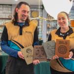 TerraVen owners Shea Looijen and Kristi Uhles hold some of the leather notebooks they designed. (Photo by Luisa Loi)