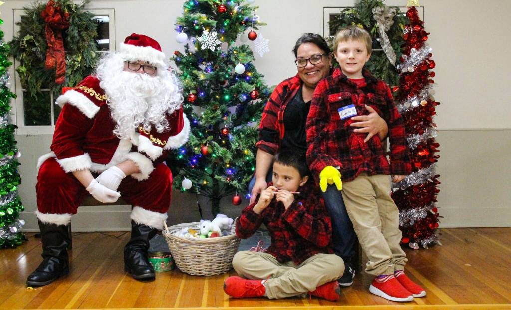 The Crofts chose to coordinate their outfits to impress Santa at the Holiday Family Fun party. (Photo by Luisa Loi)
