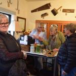 Whidbey Vintage Collective co-owners Heidi Norris, at left, and Leslie Jackson ring up purchases of Karen Heeney and Lori Sanford. The Freeland store opened in November. (Photo by Patricia Guthrie)