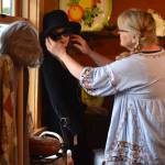 Heidi Norris adjusts sunglasses on Loretta, the mannequin mascot at the new Freeland shop, Whidbey Vintage Collective. (Photo by Patricia Guthrie)
