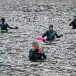 A group of friends begin their swim in the cold waters of Puget Sound. (Photo by David Welton)