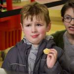 Laramie Spydell, left, is confounded by mashed radishes. Kindergarteners from Olympic View Elementary School in Oak Harbor tried plenty of unfamiliar foods, such as radishes, thanks to the Harvest of the Month program. (Photo by Rachel Rosen)