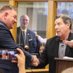 Mayor Ronnie Wright shakes hands with his predecessor, Bob Severns, after receiving the gavel and the key to the city.
(Photo by Luisa Loi)
Mayor Ronnie Wright shakes hands with his predecessor, Bob Severns, after receiving the gavel and the key to the city. (Photo by Luisa Loi)