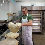 Paul stretches the pizza dough. (Photo by David Welton)