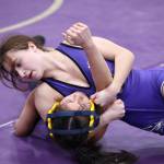 Photo by John Fisken
Oak Harbor’s Julia Gonzales tries to pin an opponent during a match Saturday during the Rock Island Rumble tournament Saturday that saw 13 schools compete at Oak Harbor High School. Gonzales placed first in the 100-pound weight class.