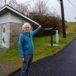 John Lovie stands next to a wellhead, which might face seawater intrusion in the future. (Photo by David Welton)