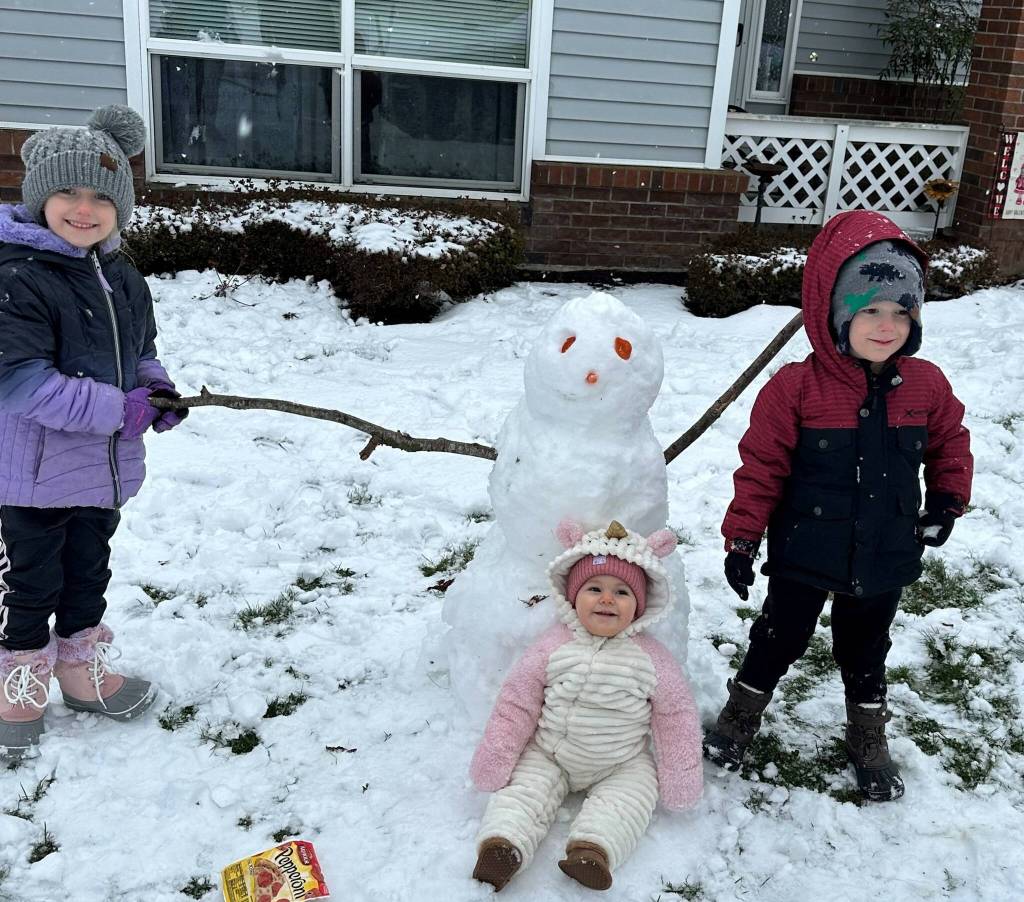 The Butler siblings, Stephanie, Cora and Nolan, built a snowman and gave it pepperoni eyes. (Photo by Samantha Butler)