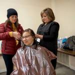 Spring Roehm volunteered to give haircuts to any homeless person that wanted one. When no one else was interested, she and Aimee Tucker groomed a volunteer. (Photo by David Welton)