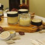 Lemon balm lip balm, a salve for minor abrasions and a candle made with orange and bergamot were all products displayed by tenth grader Alicia Jenkins. (Photo by Kira Erickson/South Whidbey Record)