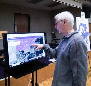 Oak Harbor resident Dennis Kjargaard points to his property at the PFAS public meeting on Thursday, which is 30 feet from the original PFAS sampling area. (Photo by Sam Fletcher)