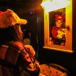 Priscilla Croft sees Jack Twists reflection in a bug-infested bathroom. (Photo by Luisa Loi)