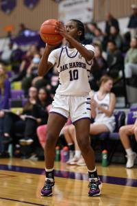 Caption – Oak Harbor’s Suki Warden takes a shot during a game against Burlington-Edison. The Wildcats are hosting a playoff game Thursday against Stanwood. Game time is 7 p.m. Photo by John Fisken.