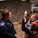 Officer Claire Herrera (left) talks with Asia James (middle), mother of William Belanger (right), whom Herrera saved, on Monday. (Photo by Sam Fletcher)