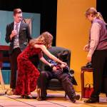 Mrs. Scarlet (Isabella Barbee) tries to make the dead motorist (Alyza Doctolero) look like shes sleeping as Mr. Green (Asher Lemme, at left) and Professor Plum (Kincaid Cochran, at right) watch. (Photo by Luisa Loi)