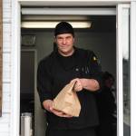 Steve Clarke hands a hungry Whidbey News-Times reporter her order. (Photo by Luisa Loi)
