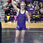 Oak Harbor’s Percie Hatfield has his hand raised in victory after a match during the regional tournament that took place Saturday at Oak Harbor High School. He placed first at 157 pounds and he will advance to the Mat Classic this weekend in Tacoma. Photo by John Fisken.