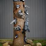 Pat McVay created the illusion of raccoons poking their heads and tails out of the tree from every angle. (Photos by David Welton)