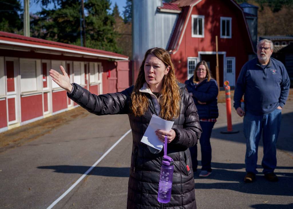 Photo by David Welton
Port of South Whidbey Executive Director Angi Mozer gestures to a white line on the midway of the Whidbey Island Fairgrounds that represents where concession stands will need to be rebuilt.