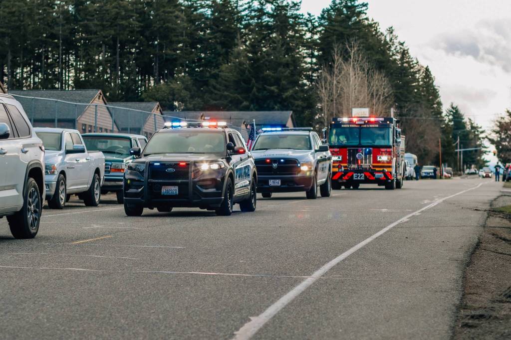 Oak Harbor police and fire rally to support Donovan Davis at his funeral procession on Friday. (Photo courtesy of Felicia Warrington)