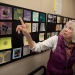 Artist Karen Rothboeck points to a piece displayed as part of Little Art, a new installation in the Freeland Library. (Photo by David Welton)
