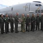 Cmdr. James Tilden, Commanding Officer of Patrol Squadron 62, presents a dedication plaque to Vice Adm. John B. Mustin, Chief of Navy Reserve and Commander, Navy Reserve Force, after taking delivery of the first new P-8A Poseidon for the Naval Air Force Reserve during a ceremony at Boeing Military Delivery Facility in Tukwila, Washington, March 6, 2024. This first delivery of the new P-8A Poseidon is a historic moment as it is the first purpose-built aircraft sent directly to the Navy Reserve’s defense architecture in its aggressive transformation as an elite warfighting organization. Our patrol aircraft deploy and operate globally in support of national defense priorities executing myriad missions ranging from supporting homeland defense (HLD), participating in exercises sustaining fleet readiness, and work alongside partner and allied nations maintaining proficiency and increasing interoperability. (Photo courtesy of the US Naval Air Force Reserve)