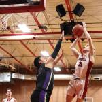 Photo by John Fisken
The difference between a First Team and Second Team All-Conference pick? Chase Anderson made the shot, and Chris Gustafson just missed on the block.