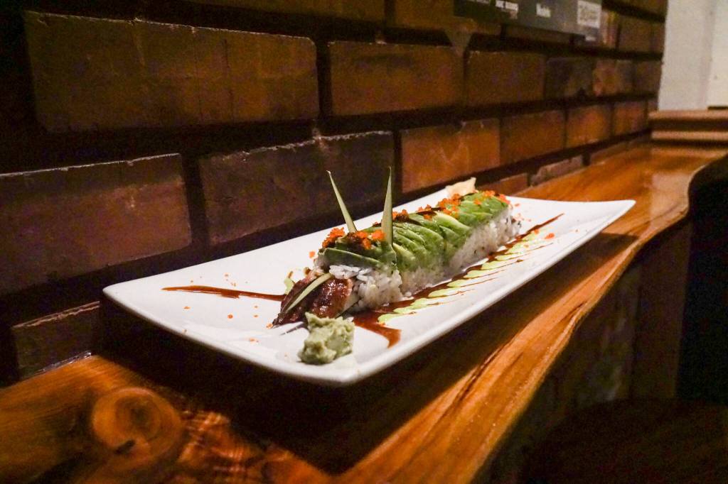 The caterpillar roll is part broiled eel sushi, part sculpture, with cucumber-sliver antennae, an avocado exoskeleton, tobiko or fish egg eyes and unagi sauce legs. (Photo by Sam Fletcher)