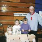 Photo provided
The Fakkema sisters pose with Elmer Veldheer, Oak Harbors klompen carver for over 20 years, in the 1990s. Rebecca Fakkema is on the right, next to Veldheer.