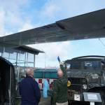 Andrew Cummings (right), PNW Naval Air Museum aircraft conservation and restoration lead, identifies damages to Executive Director Barry Meldrum on the PBY. (Photo by Sam Fletcher)