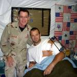 Photo courtesy of Jeffrey Neuberger
Chaplain, Lt Col, USAF (Ret) Jeffrey Neuberger stands with a wounded soldier, Gareth Evans, in Iraq.