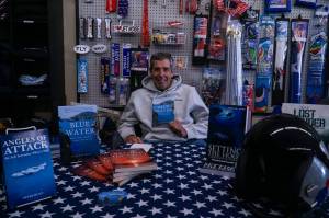 Whidbey author Peter Hunt showcasing his books at the Pacific Northwest Naval Air Museum on Thursday (Photo by Sam Fletcher)