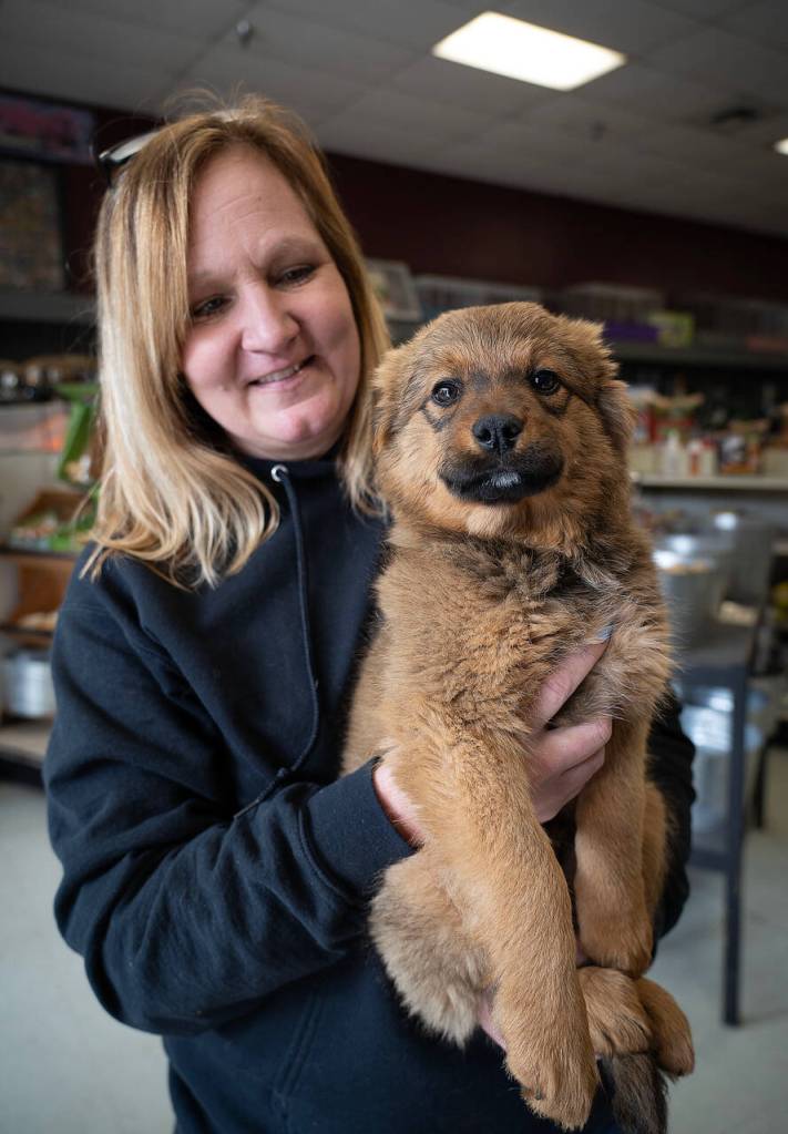 Debbie Wilkie holds Cierra, an adorable nine-week-old mutt. (Photo by David Welton)