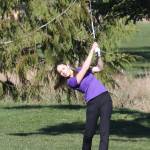 Oak Harbor girls golfer Addison Nations hits the ball during the Whidbey Shootout where the Wildcats competed against 15 other teams March 18 at the Whidbey Golf Club. Nations tied for seventh hitting 13-over-par 85. (Photo by John Fisken)