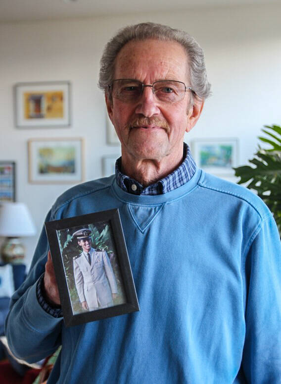 Donald Kaiser, 82, poses with a photo of himself at 24. (Photo by Luisa Loi)