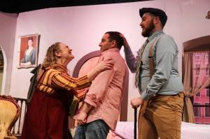 Photo by Luisa Loi
Grief Counselor Sally Chessington (played by Amy Jones) shouts at Norman (Chris Kehoe) after Eric (Wesley Moran, at right) told her hes deaf.